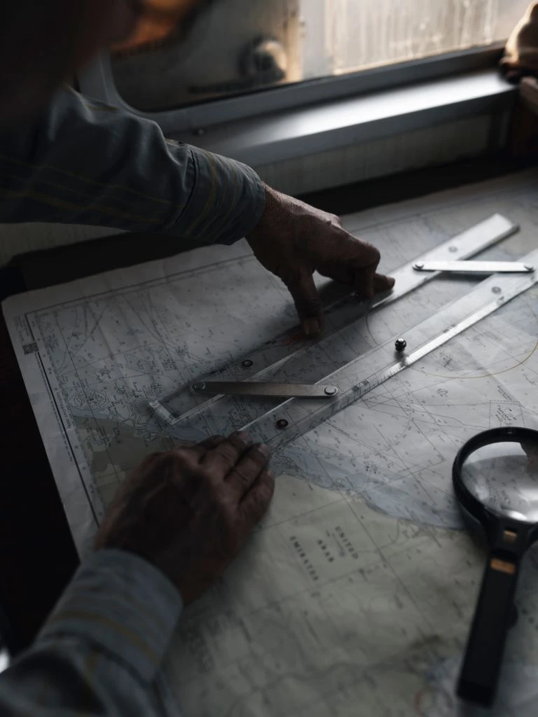 Cartographer in front of the Niagara wall map